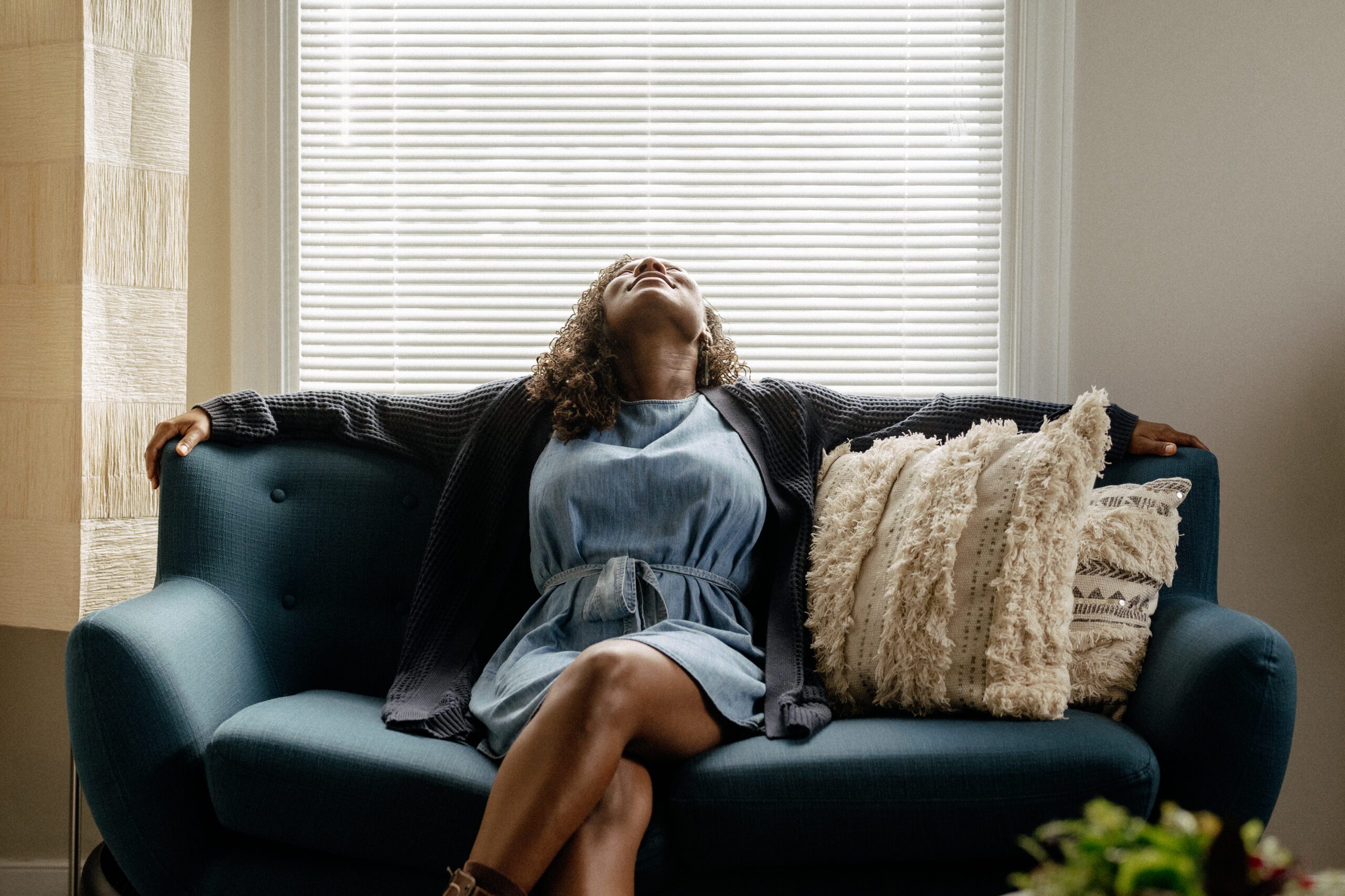 woman_focusing_on_breathing_on_a_couch