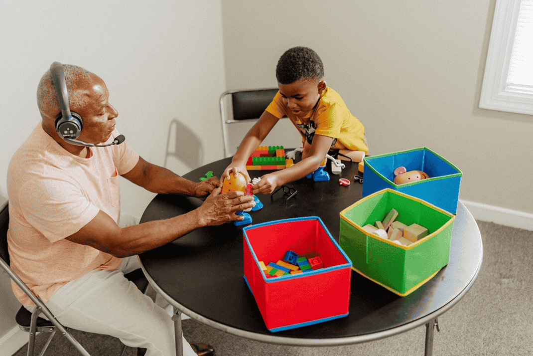 Child and Guardian playing with Toys in a PCIT session